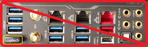 Wireless receiver installed on the back of a computer, surrounded by USB 3.0 ports and potential interference